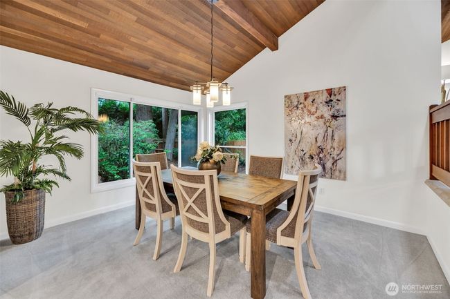 Elegant formal dining room is a lovely space for dining with family and friends | Image 8