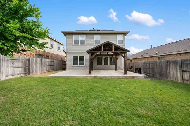 Back of house featuring a patio area and solar panels | Image 35