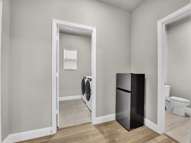 Drop zone leads to powder bath and Laundry room | Image 12