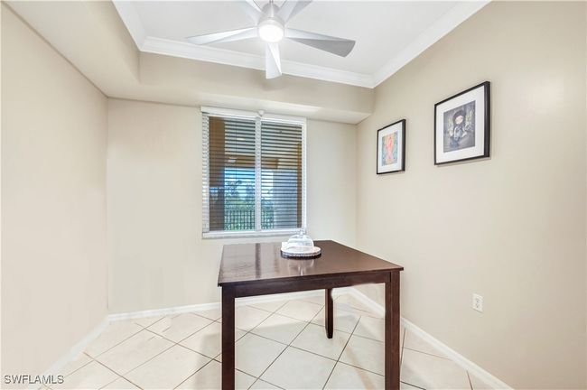Breakfast room featuring ornamental molding, light tile patterned flooring, and ceiling fan | Image 10