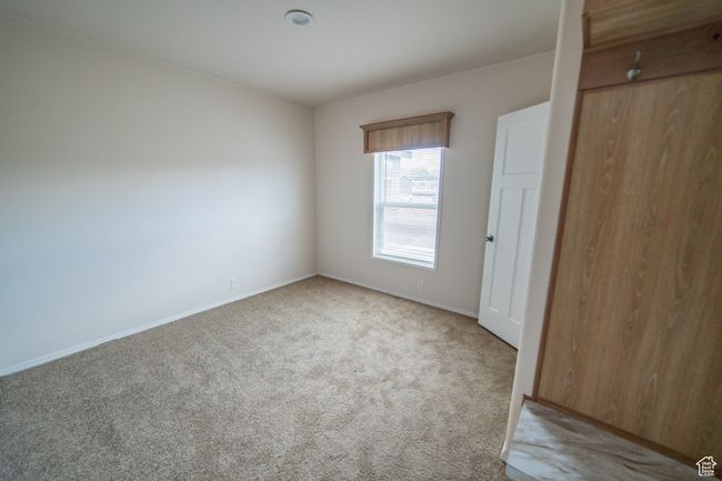 Unfurnished bedroom featuring carpet floors and baseboards | Image 67