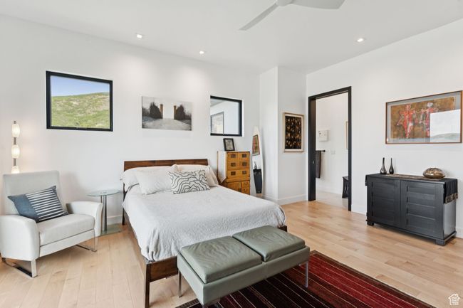 Bedroom featuring light wood-type flooring, a ceiling fan, and recessed lighting | Image 24