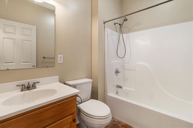 Full bathroom featuring vanity, washtub / shower combination, and toilet | Image 22
