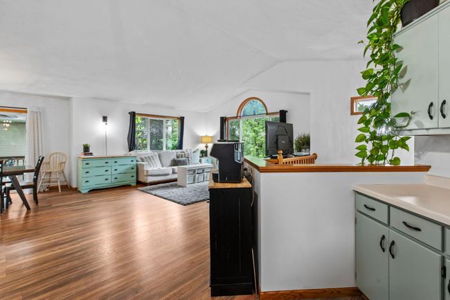 There are windows on all 3 sides of this open space giving you floods of natural light. | Image 8
