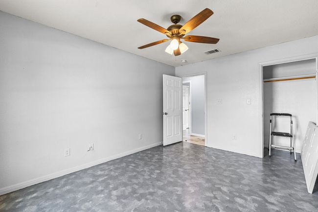 Unfurnished bedroom featuring baseboards and a ceiling fan | Image 28