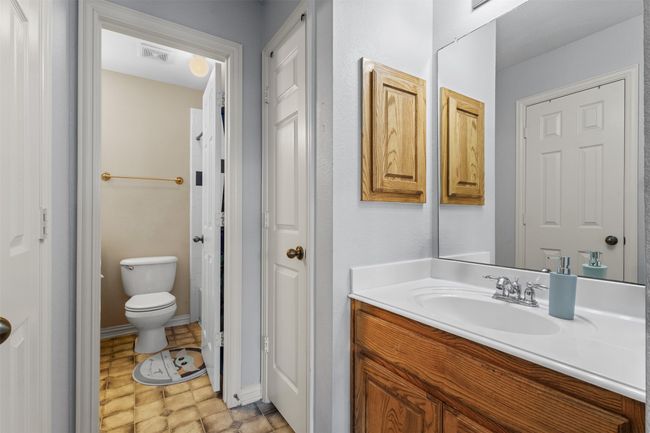Bathroom with vanity, toilet, and baseboards | Image 33