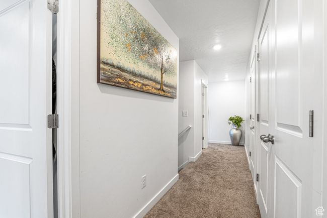 Hallway with carpet floors, baseboards, and recessed lighting | Image 18