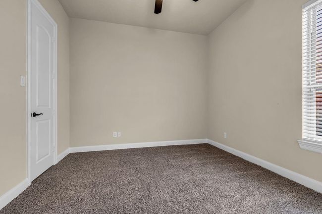 The second of twin bedroom suites connected by a shared full bath. | Image 26