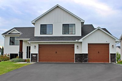 Over sized (32x27) 3 car insulated and heated garage with 8' doors. | Image 3