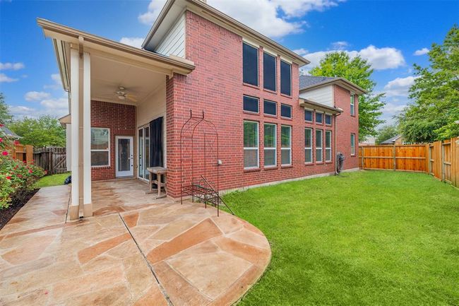 Large covered back patio. | Image 39