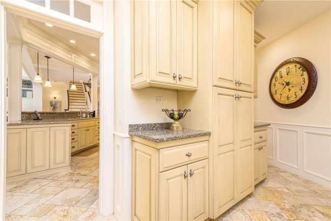 This wonderful space behind the kitchen has lots of storage. | Image 10