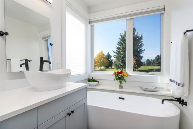 Bathroom with vanity, and soaking bathtub | Image 23