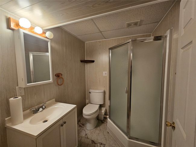 This has a corner shower making the basement available for your guest or extra family members | Image 28