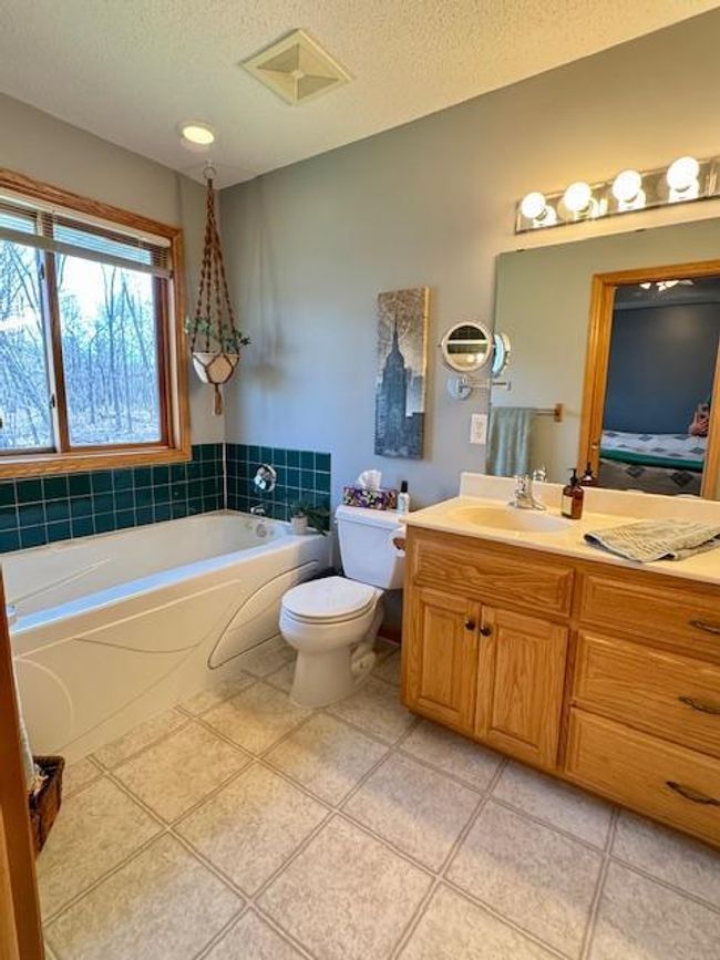 Primary bath has whirlpool tub, separate shower, dual vanity | Image 12