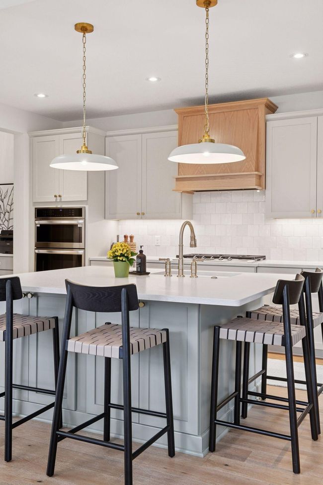 Gourmet Kitchen with soft close doors and drawers, tile backsplash and under cabinet lighting. | Image 6