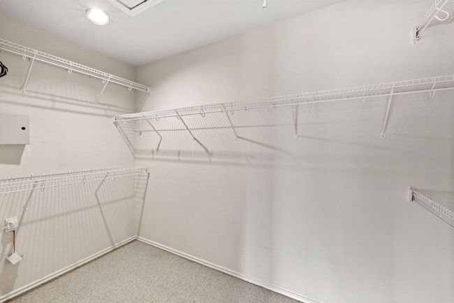 Spacious closet with carpet floors | Image 27