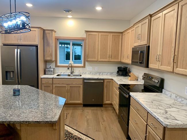 Lot of cabinet space and a pantry too! | Image 6