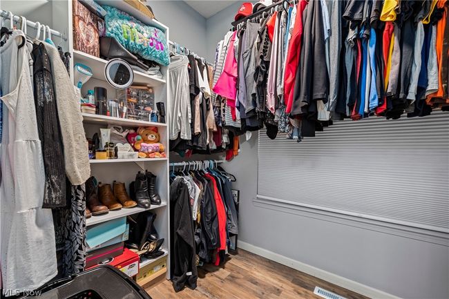 Spacious closet with hardwood / wood-style floors | Image 23
