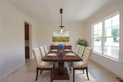 As you enter, you'll be greeted by a formal dining room and a home office with glass French doors located directly off the foyer. | Image 3