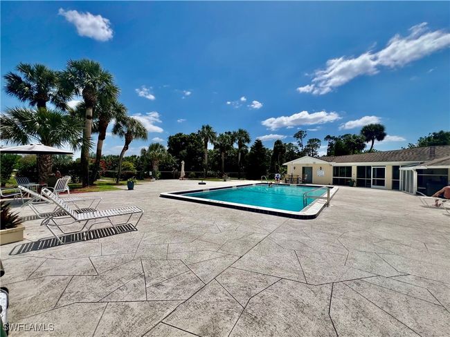Community pool with a patio area | Image 26