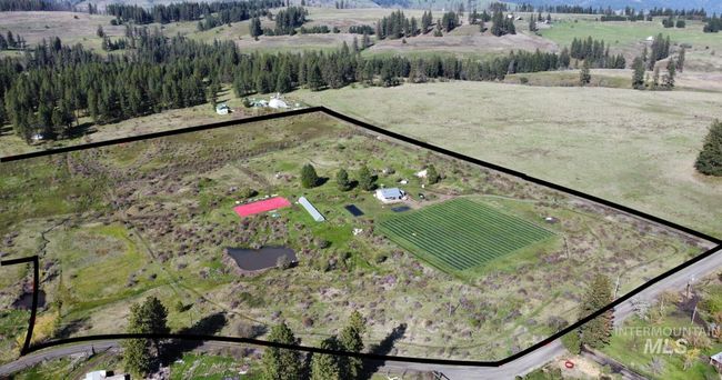 Aerial overview of property's location featuring rural landscape and property parcel outlined | Image 49
