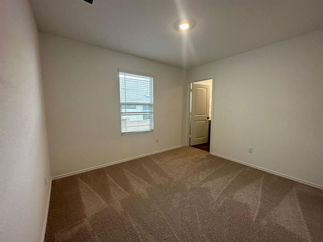 Spare room with carpet flooring and baseboards | Image 9