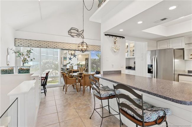 View from living area into kitchen/dining | Image 8