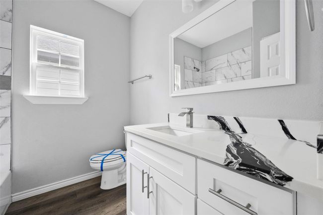 Bathroom featuring vanity and wood finished floors | Image 10