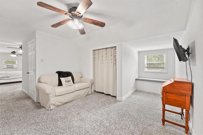 Charming upstairs sitting area with inviting nooks and natural light—perfect for reading, lounging, or creating a personalized hideaway. | Image 15
