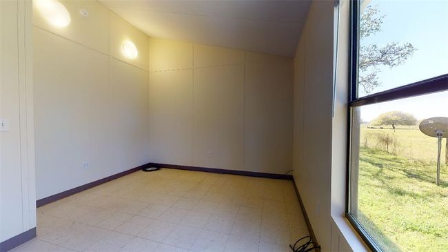 Unfurnished room featuring lofted ceiling and baseboards | Image 46