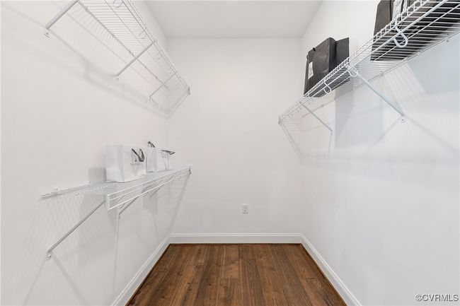 Walk in closet with wood finished floors | Image 22