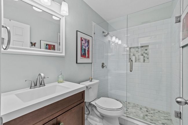 MAIN: Remodeled bathroom featuring vanity and walk-in shower. | Image 20