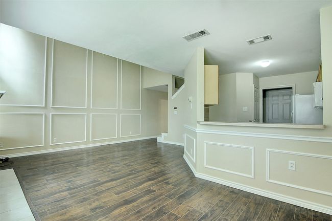 Empty room with dark wood-type flooring | Image 9