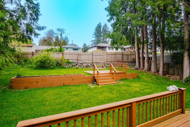 View of yard with a fenced backyard and a wooden deck | Image 31