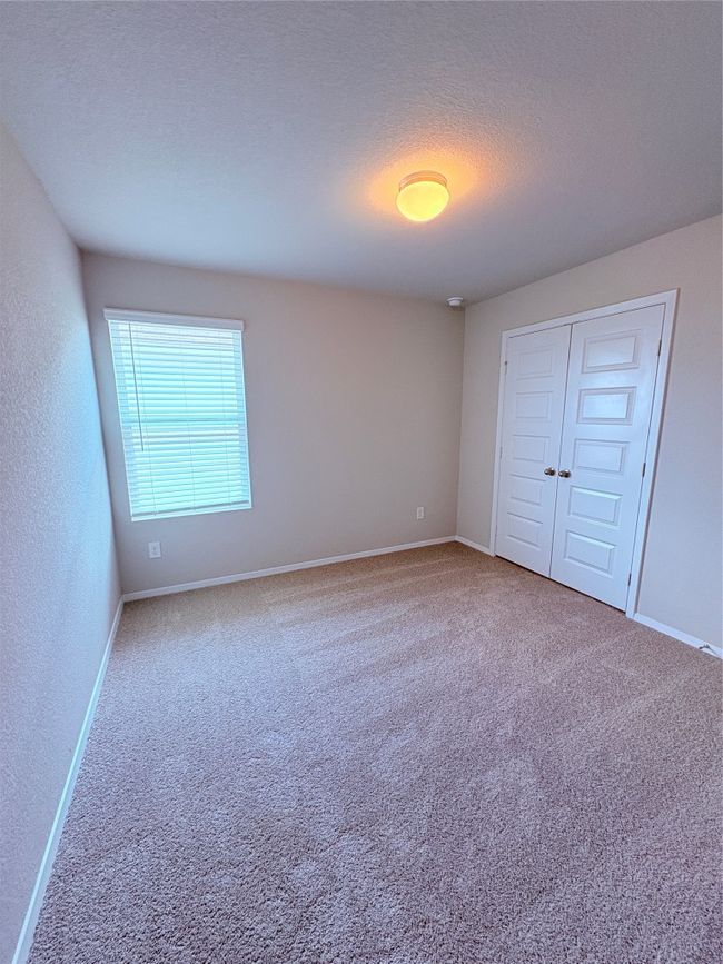 Unfurnished bedroom with baseboards and carpet flooring | Image 19