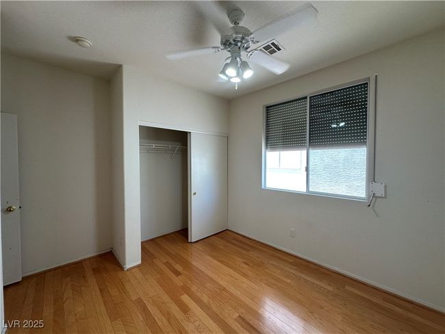 Unfurnished bedroom featuring light wood-type flooring, a closet, and ceiling fan | Image 26