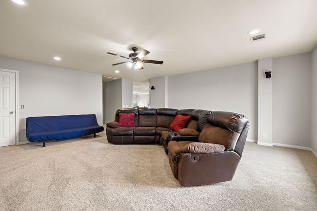 A huge media room/game room is separate from the bonus room and offers an extra living space! | Image 33