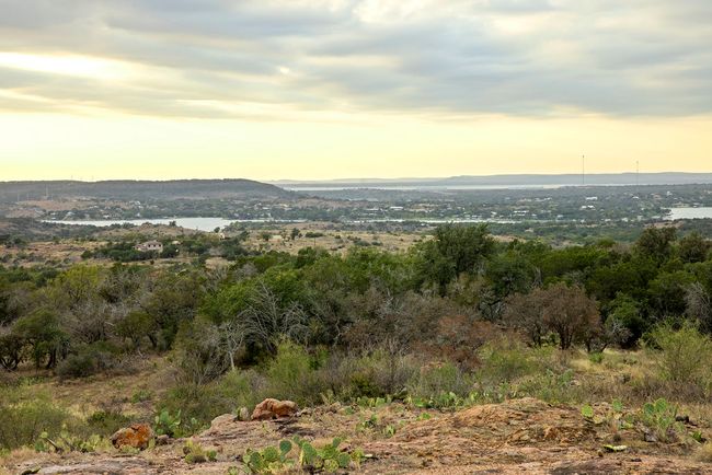 View of mountain backdrop with a large body of water | Image 7
