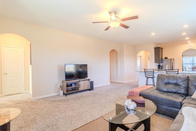 Living room featuring light colored carpet and ceiling fan | Image 13