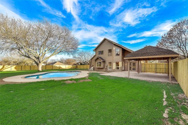 Back of property featuring a patio, a fenced backyard, and roof with shingles | Image 22
