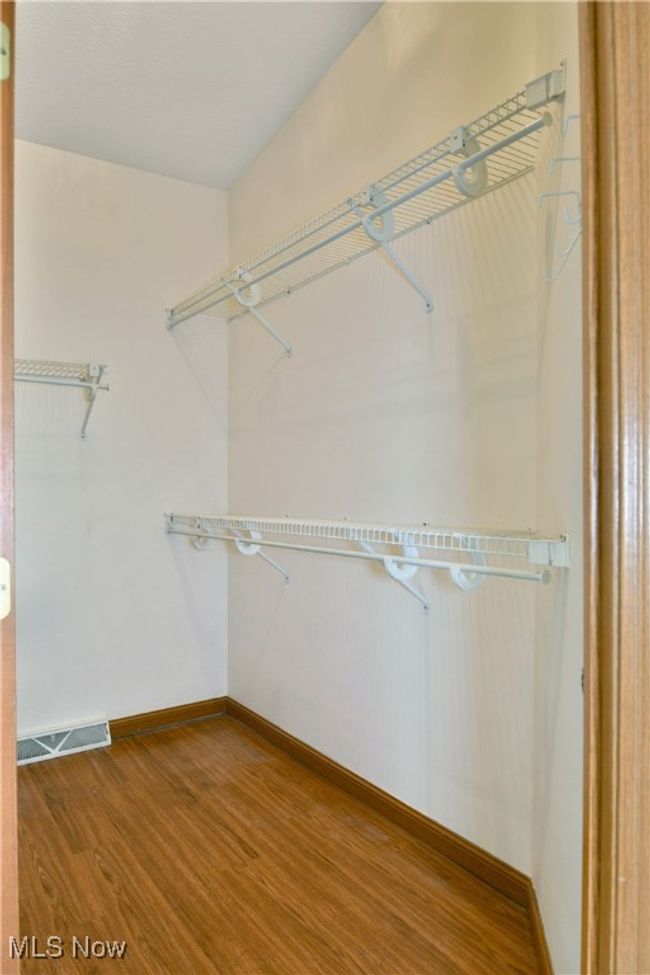 Walk in closet with wood finished floors | Image 40