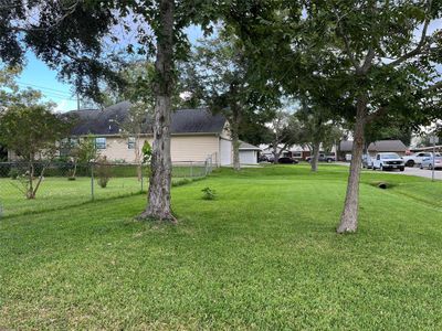 This is taken near the driveway of 1867 Aspen (Lot 18), looking toward the west. The chain link fence is set back near the building line. You have room for a long driveway and could build a few feet in front of this fence. | Image 2