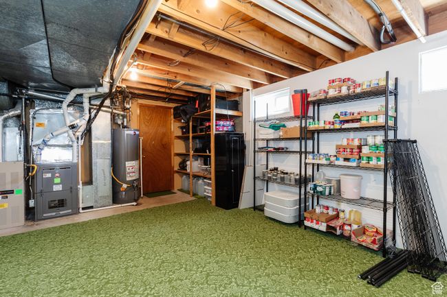 Basement featuring gas water heater and heating unit | Image 32