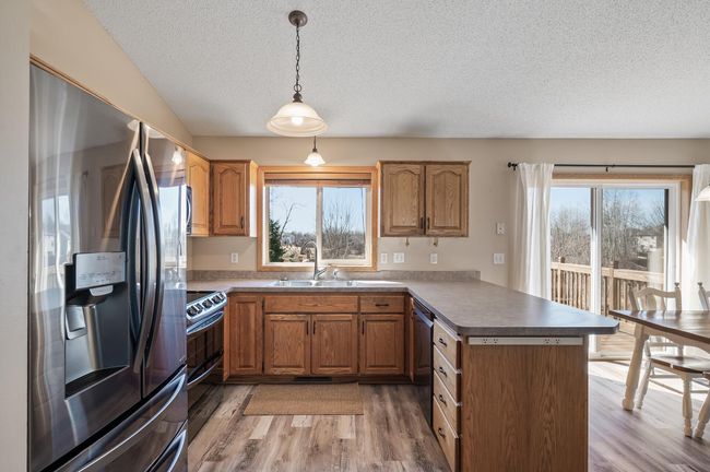 Great cabinet and counter space. Window overlooks the private backyard | Image 13