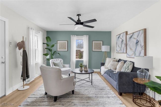 Living room featuring ceiling fan and light hardwood / wood-style floors | Image 5