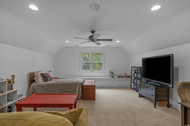Carpeted bedroom featuring lofted ceiling, recessed lighting, and ceiling fan | Image 33