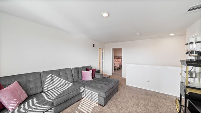 Carpeted living room with recessed lighting and baseboards | Image 24
