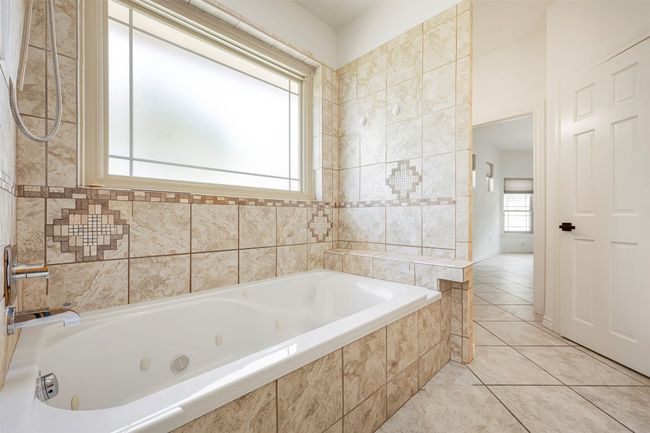 Bathroom with a whirlpool tub. | Image 20