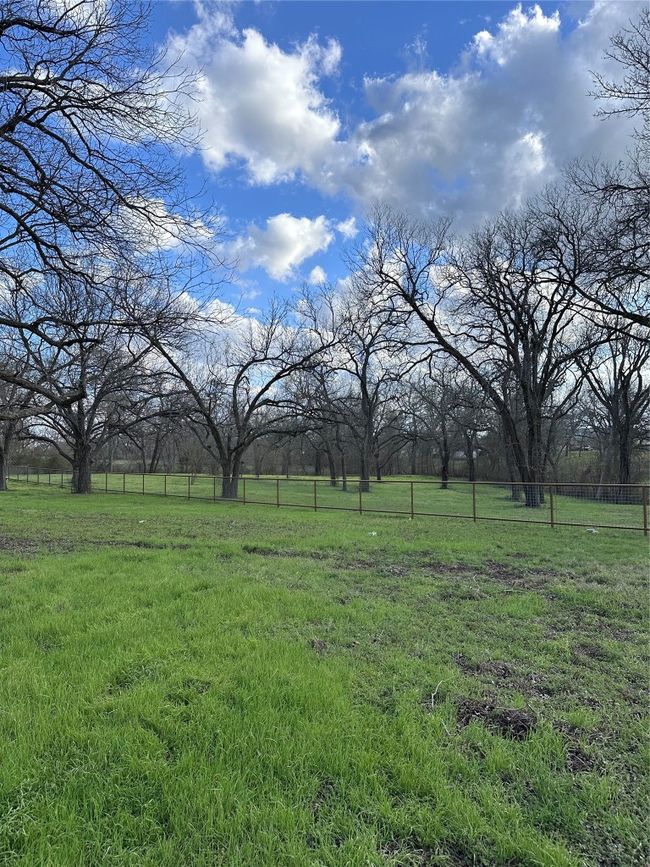 View of yard with a rural view and fence | Image 11
