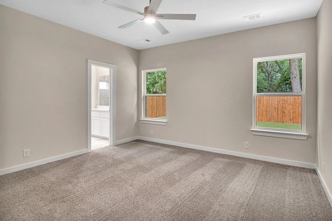 Unfurnished room featuring carpet and a ceiling fan | Image 10